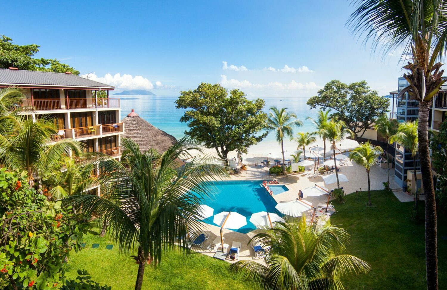 Promo Period Extended! Stay Twice at Choice Privileges and Get 8,000 Points or $50 Gift Card thru July 21 4 Coral Strand Smart Choice Hotel Exterior View 16 scaled e1689762823482