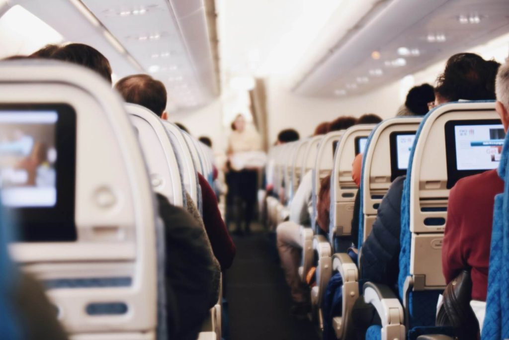 Delta Premium Select Basic: What You Lose Compared With Classic 4 Airplane cabin aisle, the kind of seat Premium Select Basic and Classic both fly in