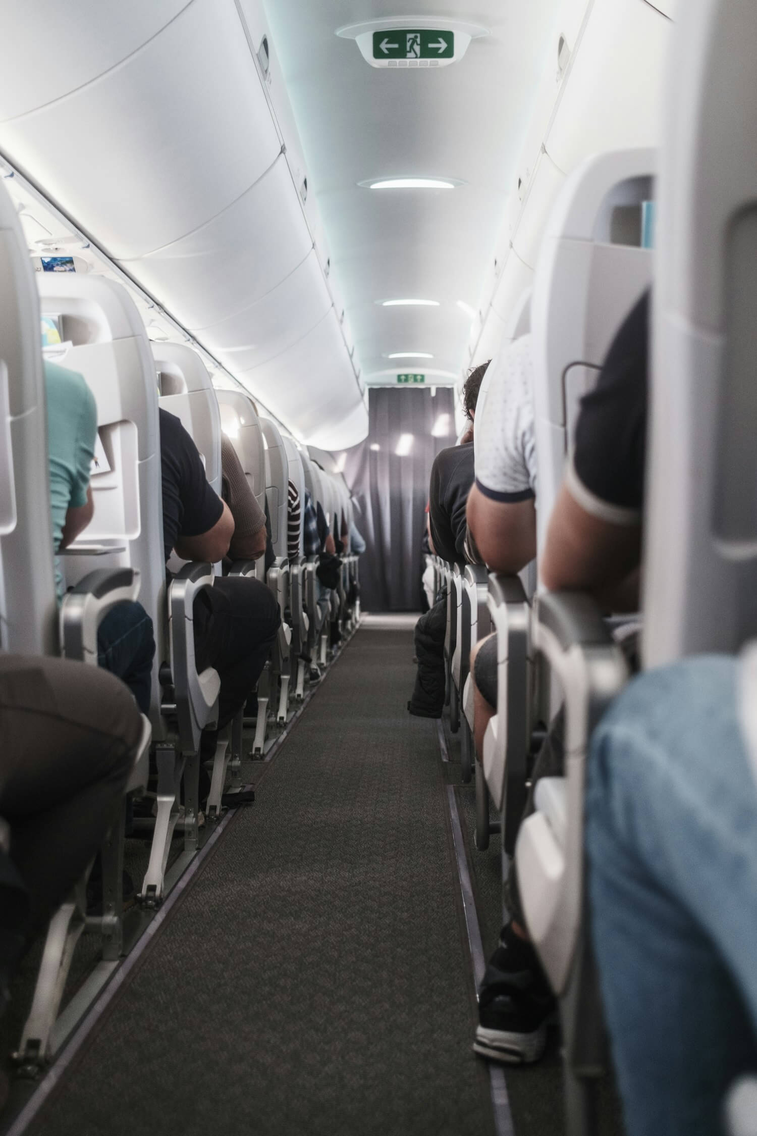 JetBlue Points On Repeat: TrueBlue Subscriptions Explained 1 Airplane cabin aisle, representing a JetBlue TrueBlue points subscription