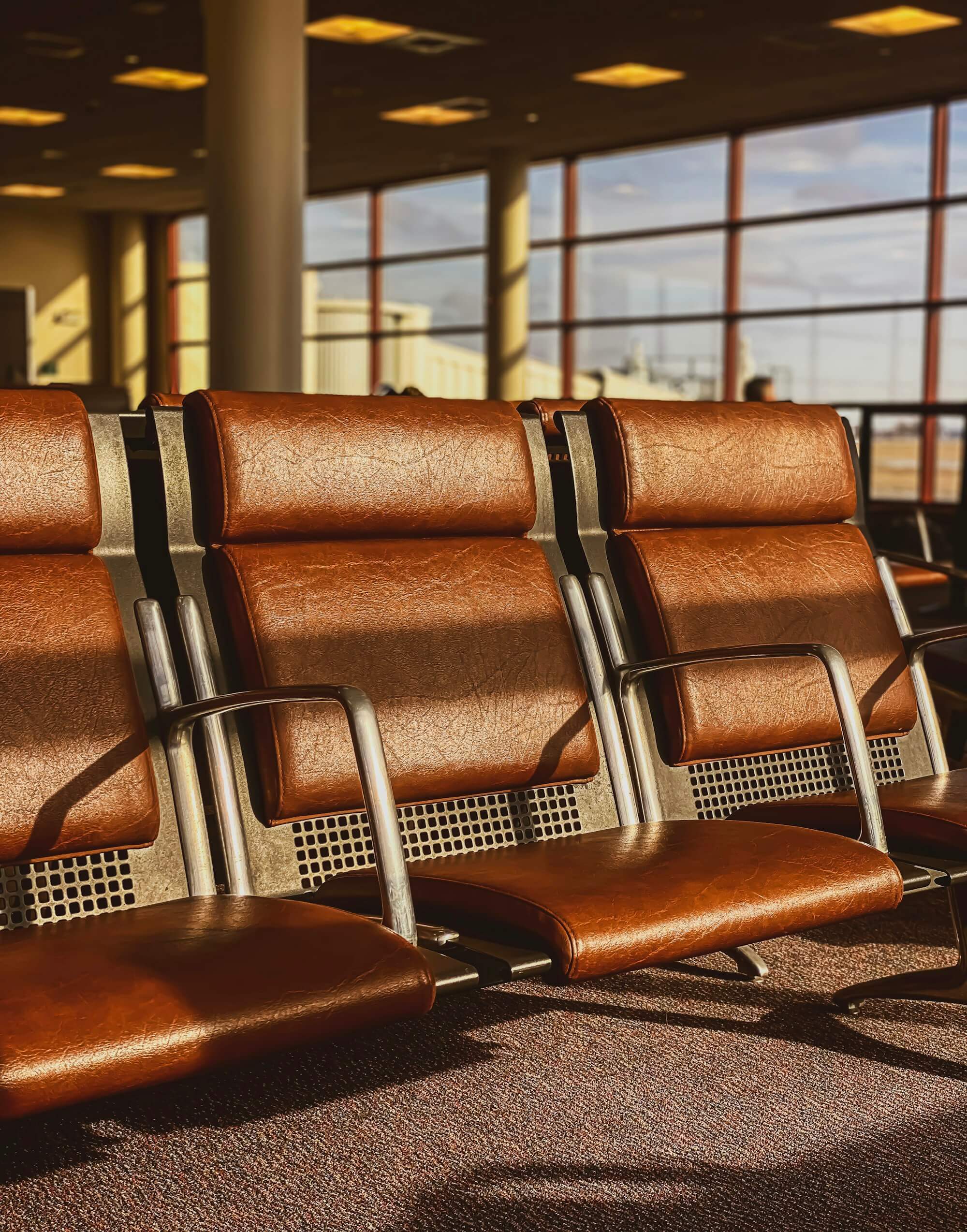 Airport lounge seating with a view of the tarmac