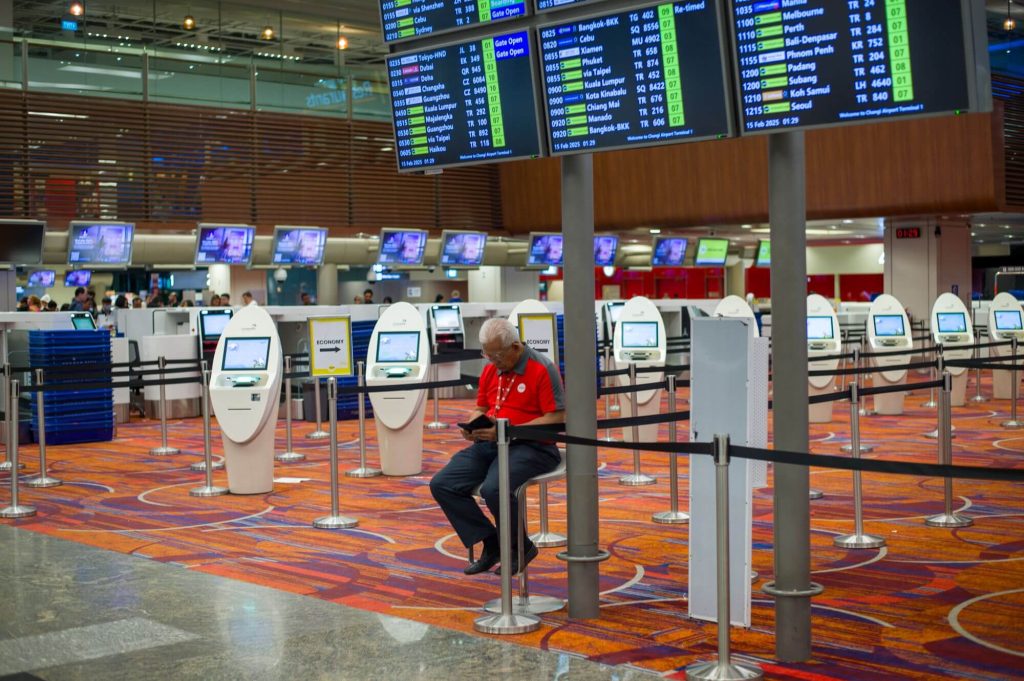 Airport terminal with self-service check-in kiosks