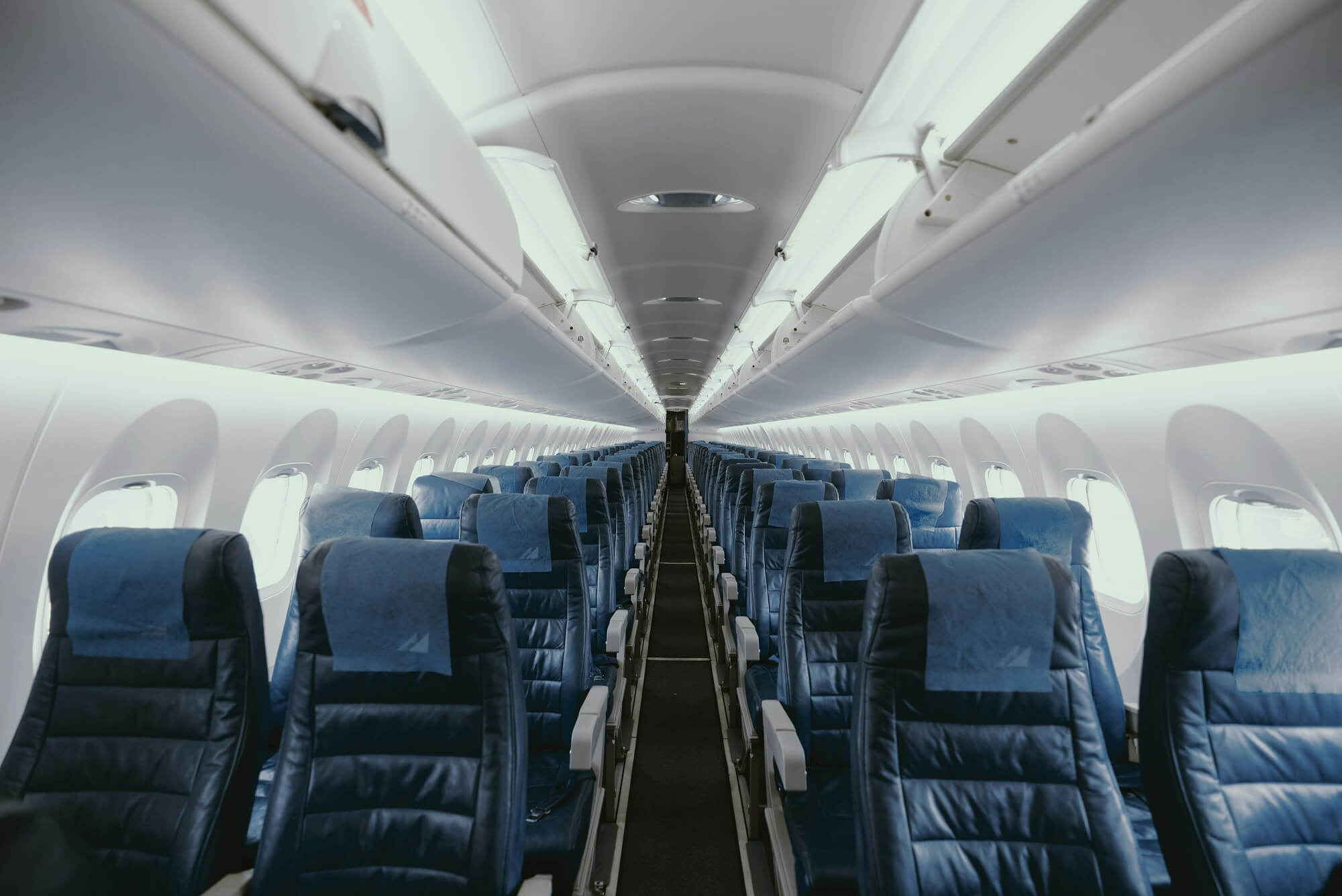 When Does British Airways Release Avios Award Seats? 1 Empty airplane cabin with rows of blue seats