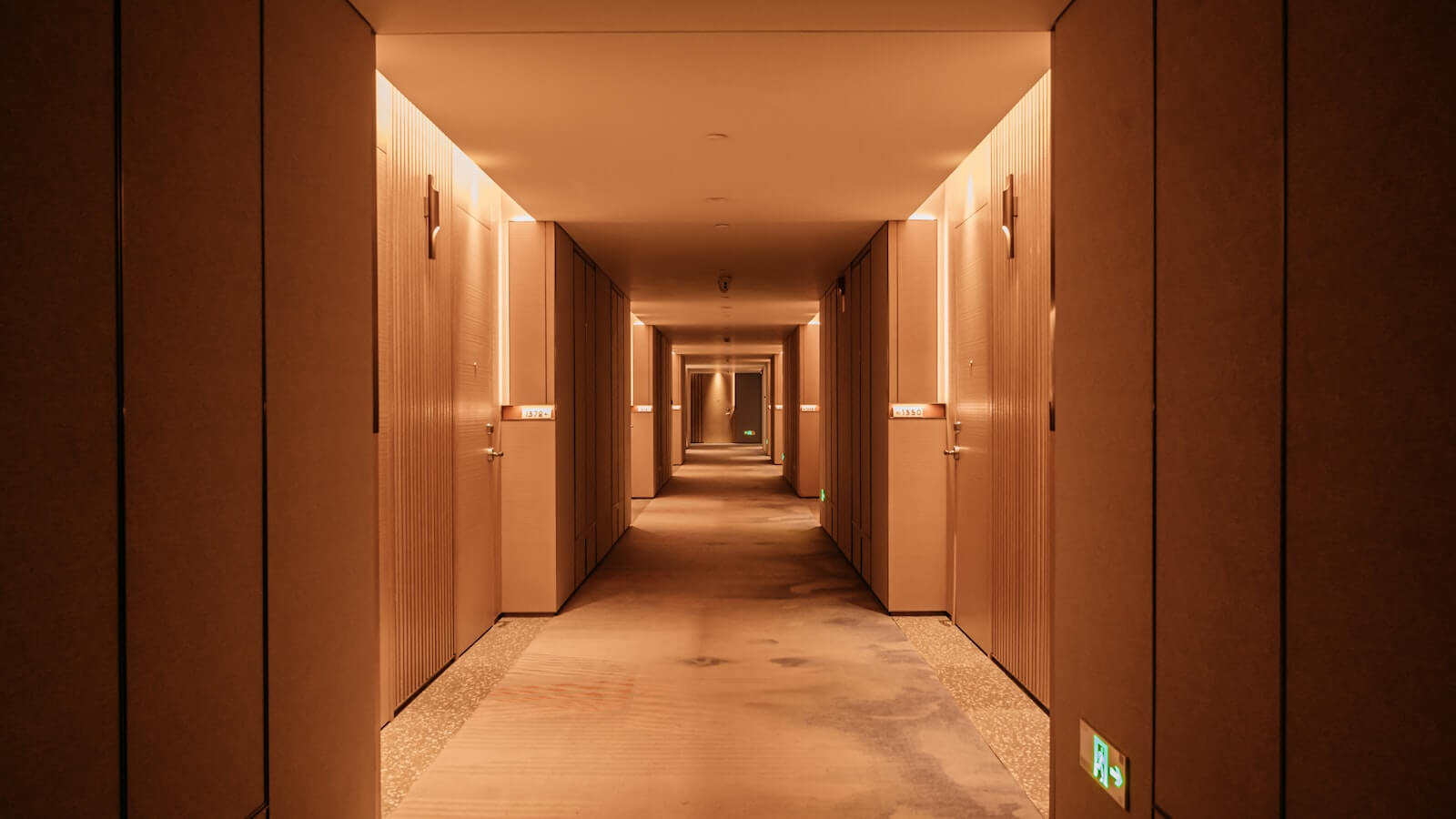 Can Marriott Elite Night Credits Be Transferred to Another Person? 3 Hotel hallway with guest room doors