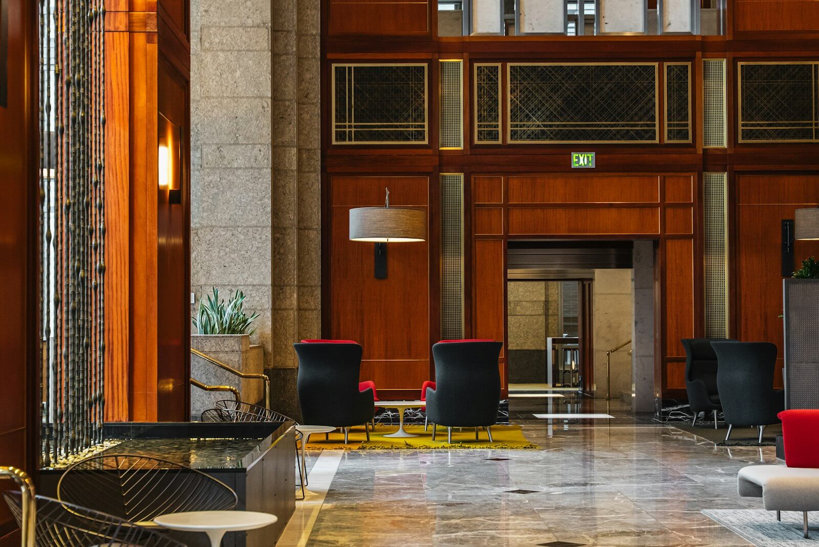How Marriott Elite Night Credits Work With Back-to-Back Stays 1 Elegant hotel lobby lounge with wood paneling and seating