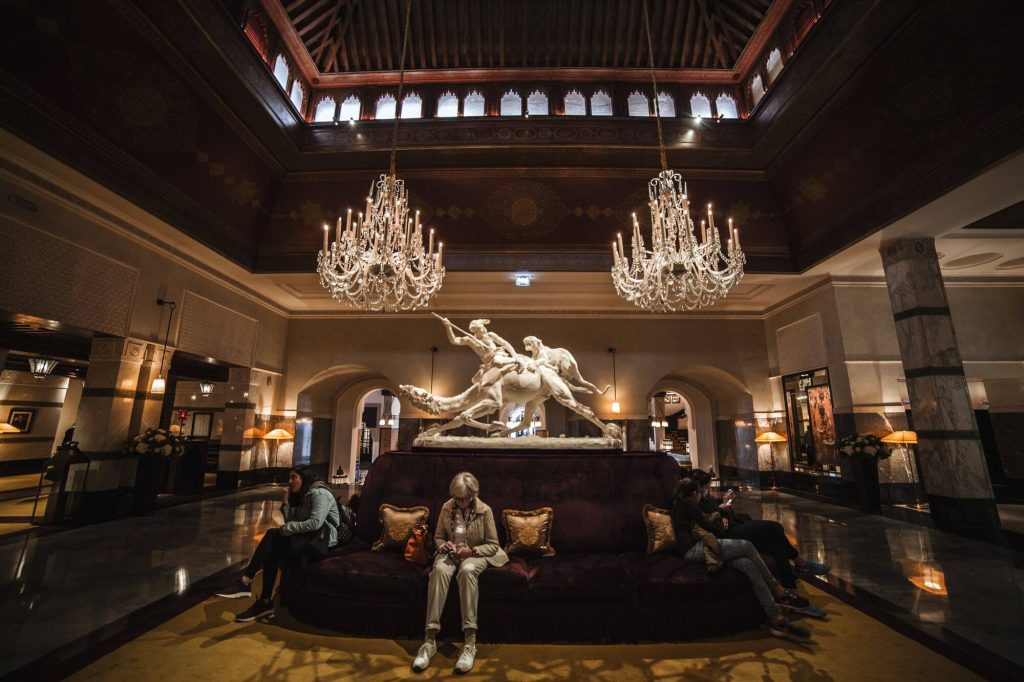 Spacious luxury hotel lobby with crystal chandeliers