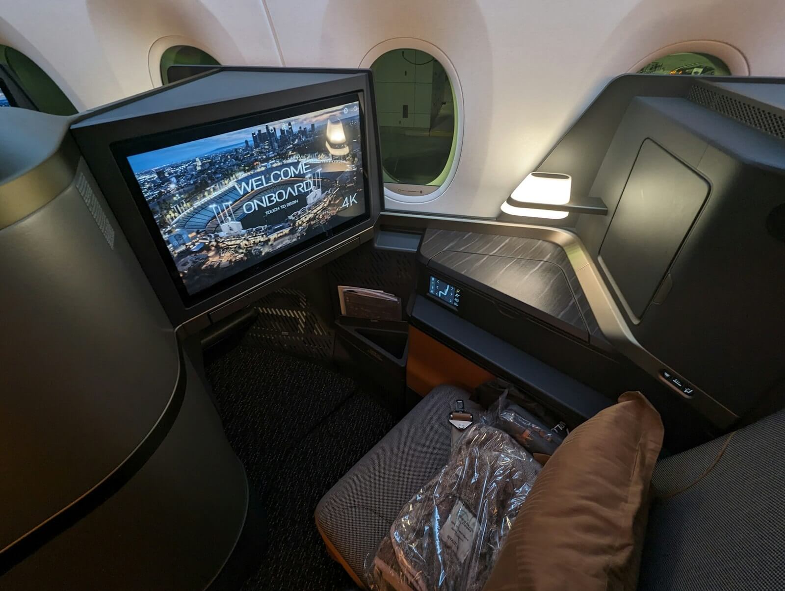 Delta Complimentary Upgrades for Companions: How It Actually Works 14 Premium cabin suite seat, the kind of upgrade a Medallion member and companion could clear into