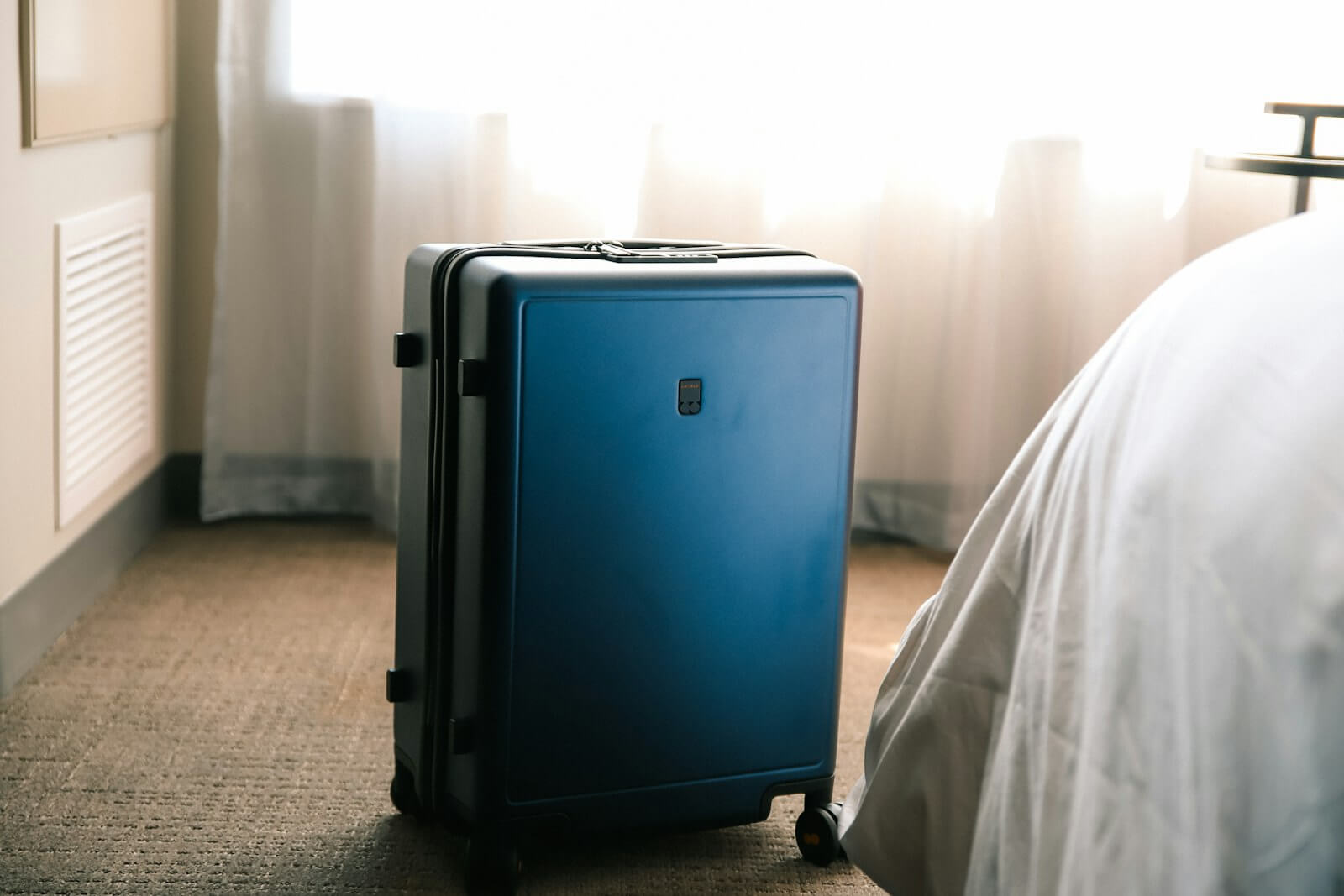 How Marriott Elite Night Credits Work With Back-to-Back Stays 3 Suitcase in a hotel room