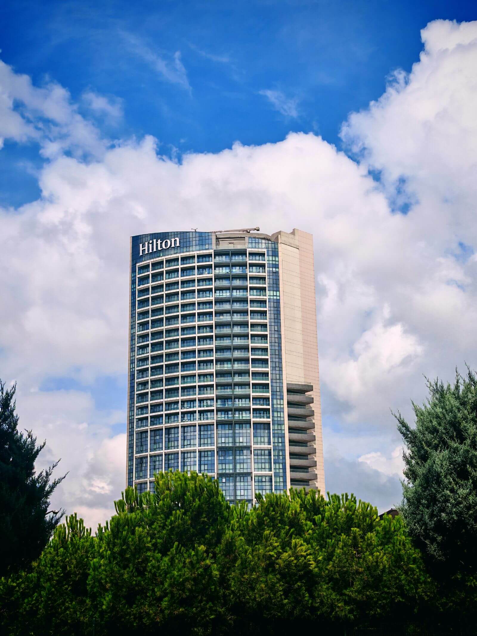 How to Convert Hotel Points to Avios 2 Hilton hotel tower exterior against a blue sky