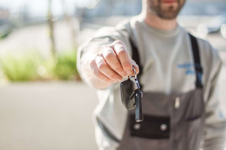 IHG Quietly Changes Its Hertz Partnership Points Structure 9 Person handing over a car rental key, representing the IHG-Hertz points partnership