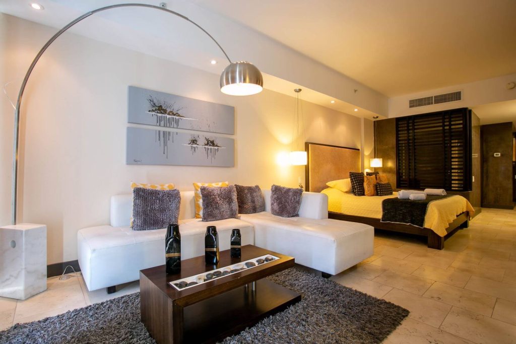 Marriott Is Testing a New Upgrade Waitlist That Ranks Elite Members 10 Modern hotel suite with living area and bedroom