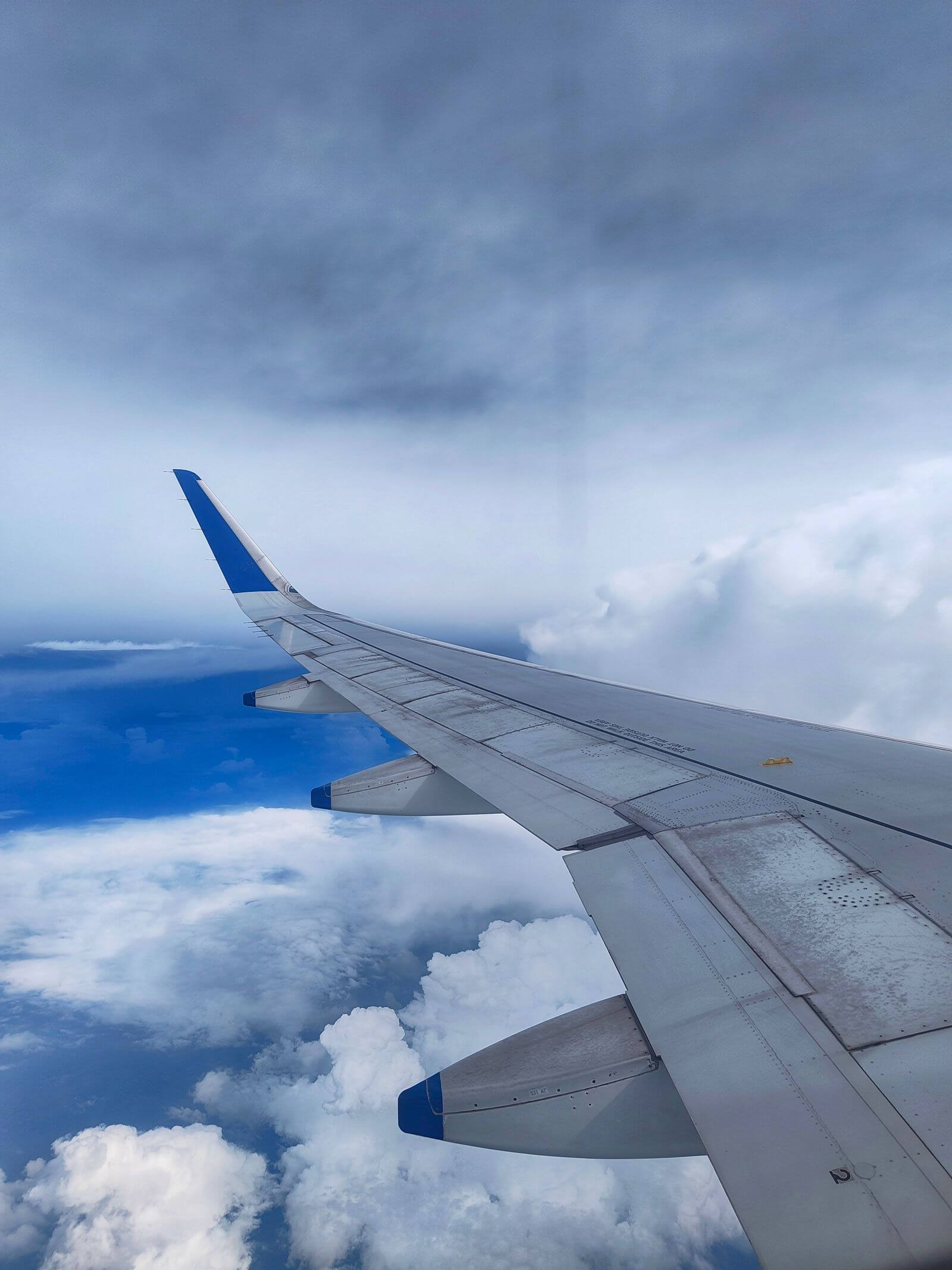 United Explorer Card Review: Is the $150 Fee Worth It? 14 Airplane wing above clouds during flight